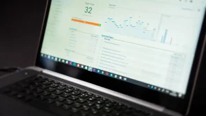 laptop displaying an analytics dashboard with charts