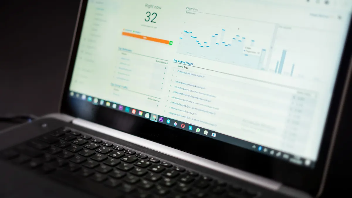 laptop displaying an analytics dashboard with charts