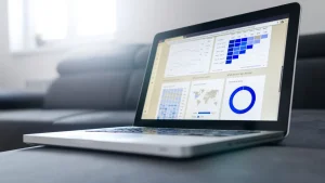 Laptop displaying analytics dashboard charts